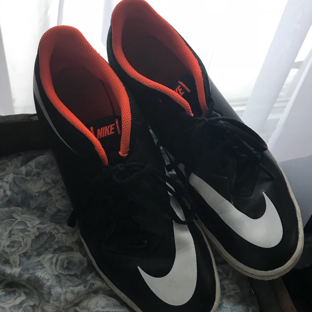Nike orange and black men’s indoor cleats